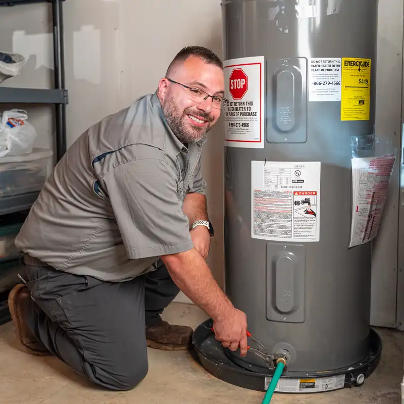 Plumber fixing a tank water heater